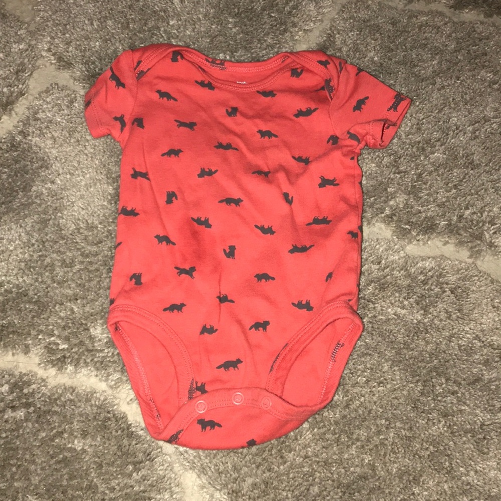 Never worn Carter’s 6 month onsie